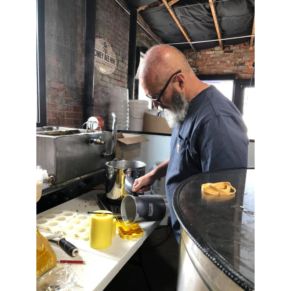 Leonard in Kitchen pouring candles